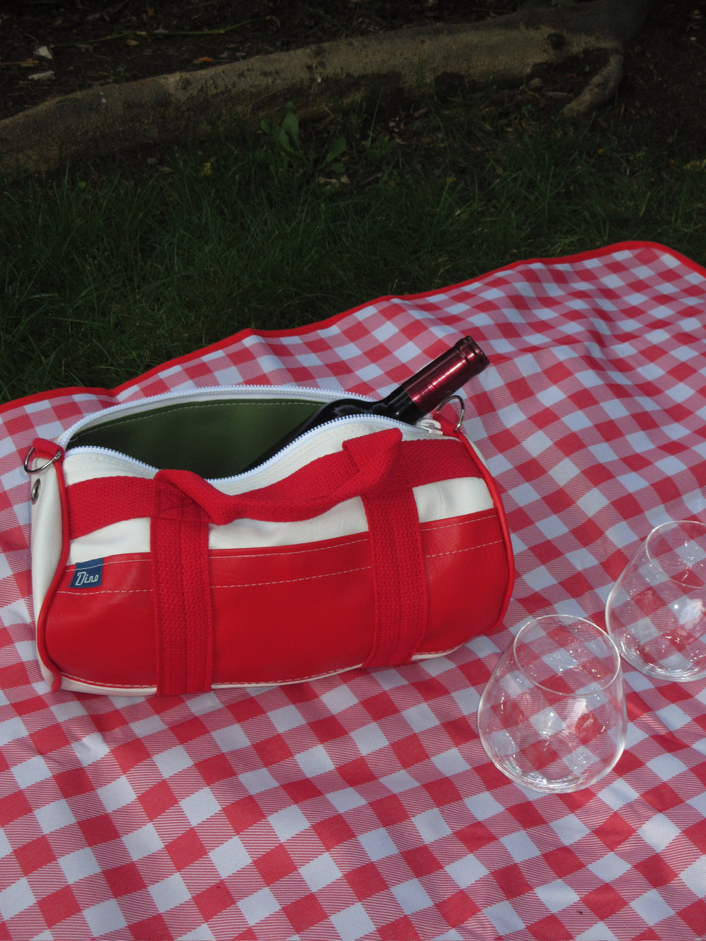 Parkside barrel duffel open with wine bottle inside, side view